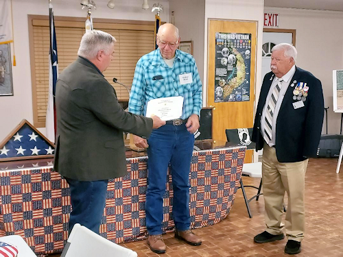 Chancelor Bill Sekel presents the Past President Certificate to outgoing President Clarence Burns.