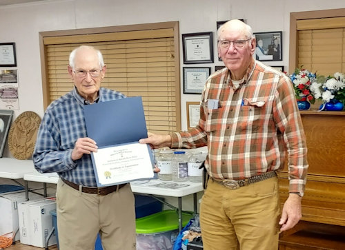President Clarence Burns presents a Certificate of Appreciation to Compatriot Harold Blair for his program, "The Revolutionary War in the South".